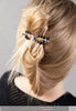 Flexi flip hair clip with black onyx and imitation rhodium beads in hair.