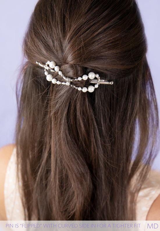 Flexi flip hair clip with glass pearls and imitation rhodium beads in hair.