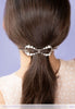 Flexi flip hair clip with glass pearls and imitation rhodium beads in hair.