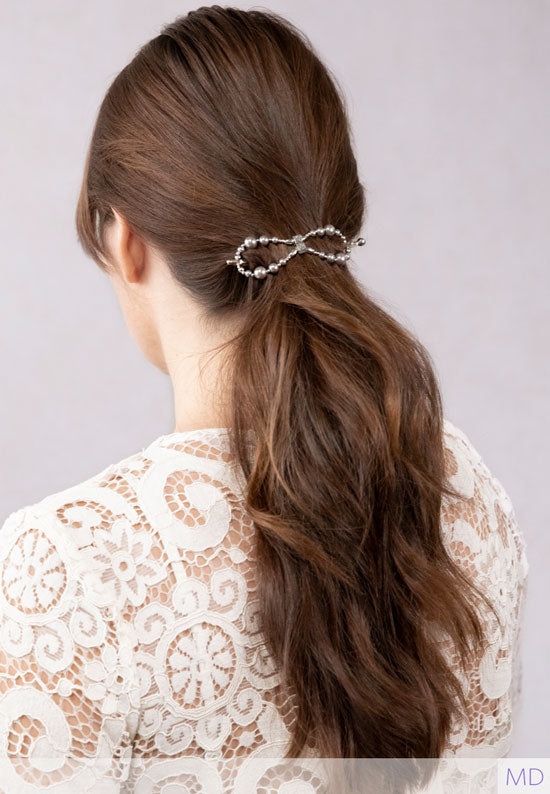 Teri Flexi Flip with hemalyke beads and plated in imitation rhodium shown in hair.
