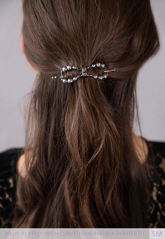 Teri Flexi Flip with hemalyke beads and plated in black silvertone shown in hair.