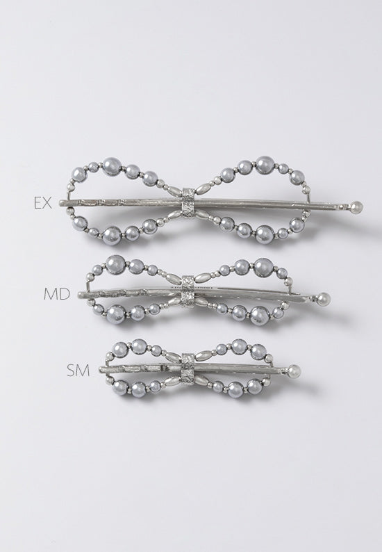 Teri Flexi Flip with hemalyke beads and plated in imitation rhodium available in three sizes.