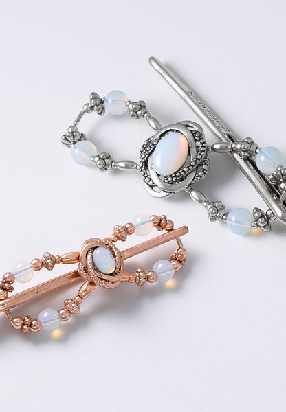 Opaline Flexi Clip with a delicately framed opal stoneset. Available in rose goldtone and silvertone