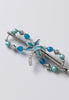 Palm tree flexi hair clip accented with different hues of blues.