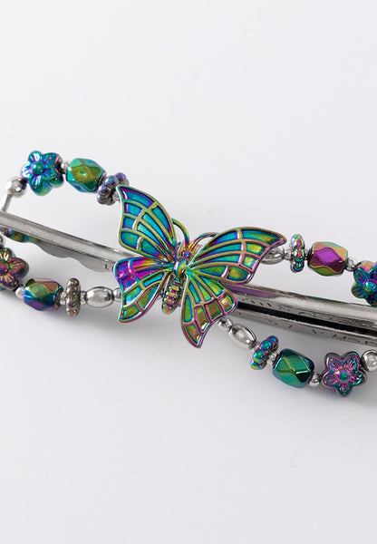 Butterfly flexi hair clip with blue metallic finish.