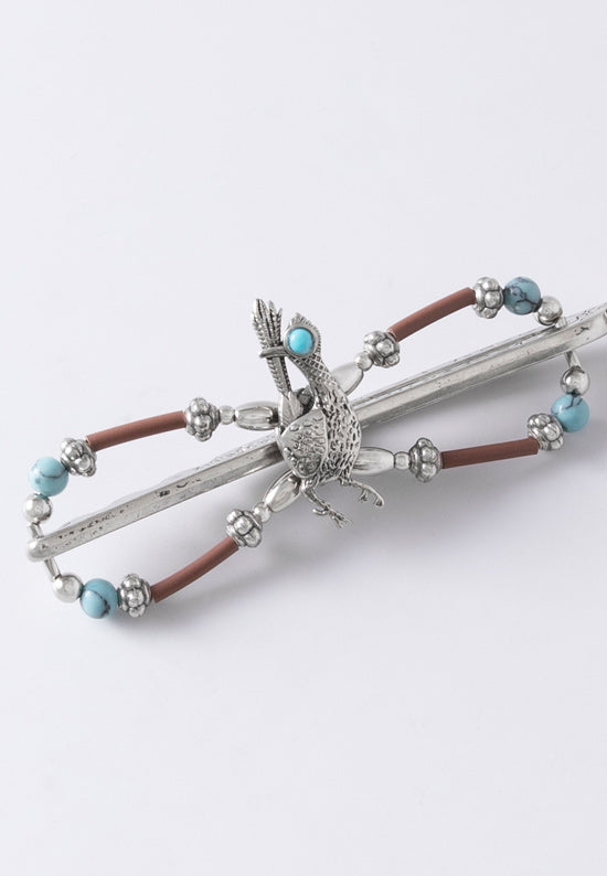 Roadrunner flexi hair clip with brown and turquoise accents.