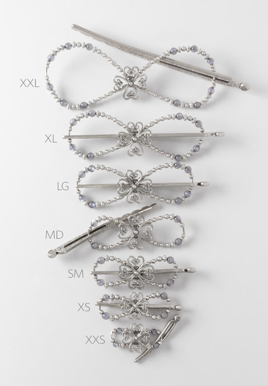 All 7 sizes, from XXL thru XXS, of the ornate clover flexi hair clip.