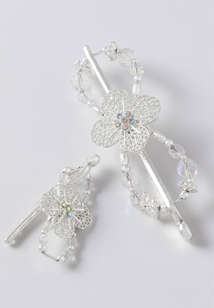 Filigree flower flexi hair clip with bright silvertone and sparkling clear crystal accents.