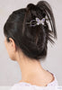 Irene Flexi shown in hair featuring a beautiful butterfly with delicately detailed wings and lavender and purple pearls.