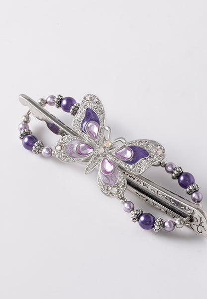 Irene Flexi features a beautiful butterfly with delicately detailed wings and lavender and purple pearls.