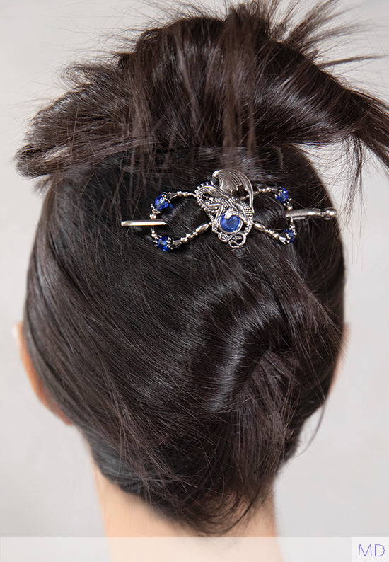 close up of dragon flexi clip holding brunette hair in an all up hair style