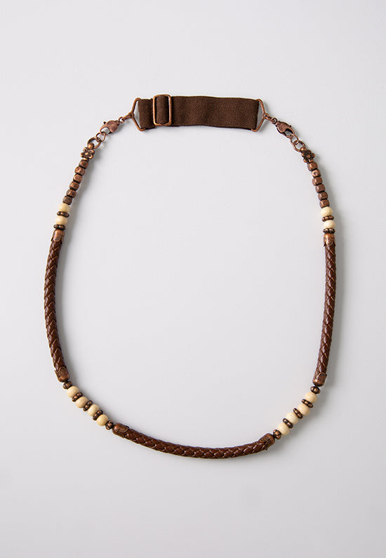 Dark brown leather hairband accented with antiqued copper and wooden beads. 