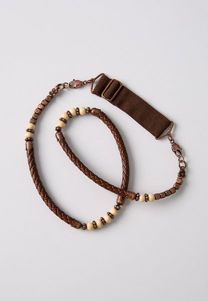 Dark brown leather hairband accented with antiqued copper and wooden beads. 