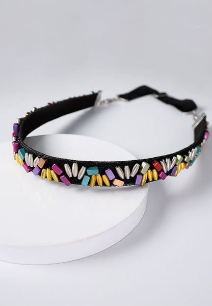 Bright multi-colored metallic beads on a black band.