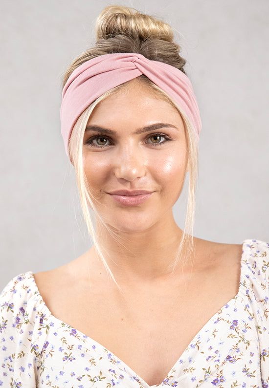 Dusty Rose jersey knit hairband shown in hair.