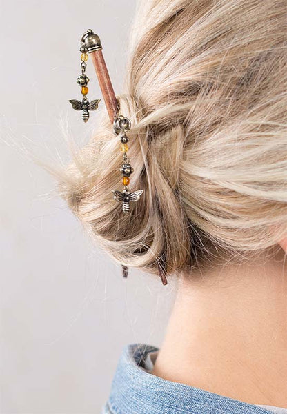 Cute honey bee dangle hair stick with warm and rich amber-like honey, topaz brown, and antiqued brass accents.