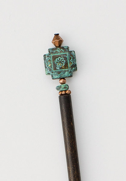 Hair stick with patina geometric design and copper accents. 