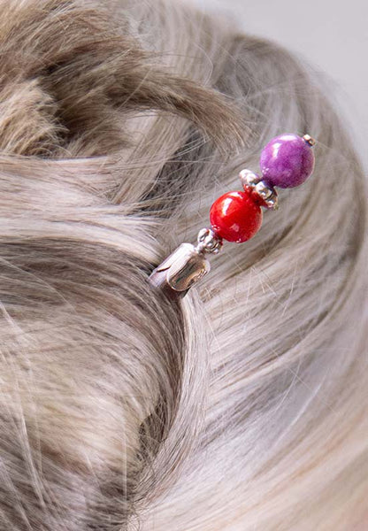 Red and purple round beaded hair stick with silver tone accents.