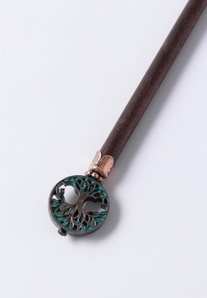 Genesis hair stick features the tree of life with coppertone and patina accents. 
