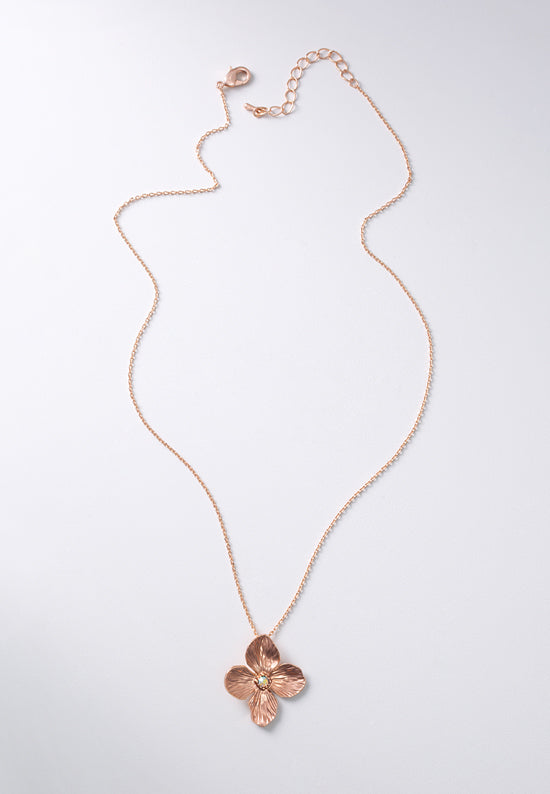 Posie necklace in rose goldtone features a pure and precious flower with crystal aurora borealis center stone.