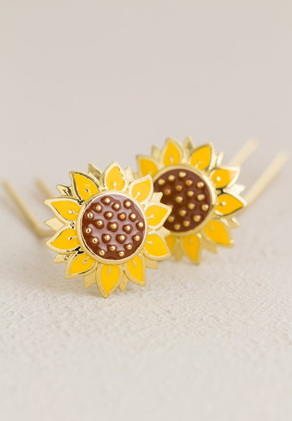 Brass tone sunflower hair pin.