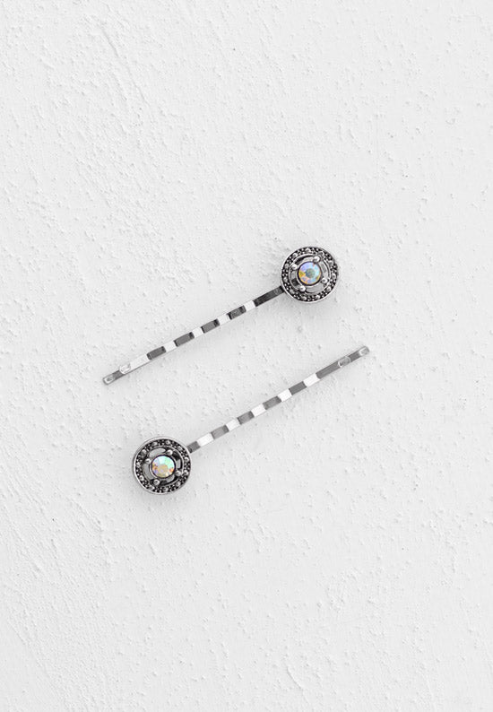Bobby pin adorned with a lovely circle set with aurora borealis stone.