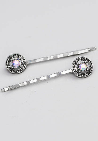 Bobby pin adorned with a lovely circle set with aurora borealis stone.