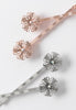 Elegantly designed flower available in silvertone and rose goldtone.
