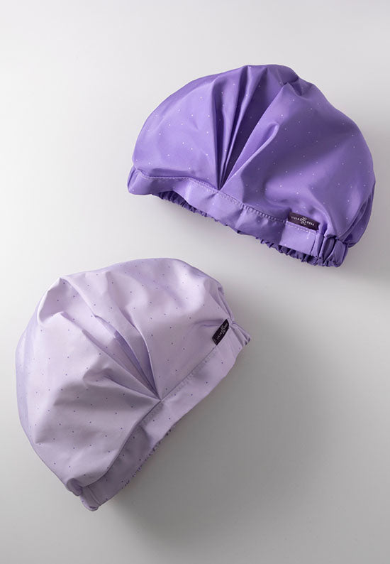 Shower Cap comes in your choice of two beautiful shades of purple with polka dots