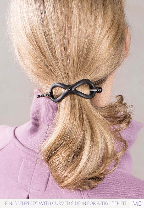 Medium Black Flexi Sport securely holds hair in a ponytail.