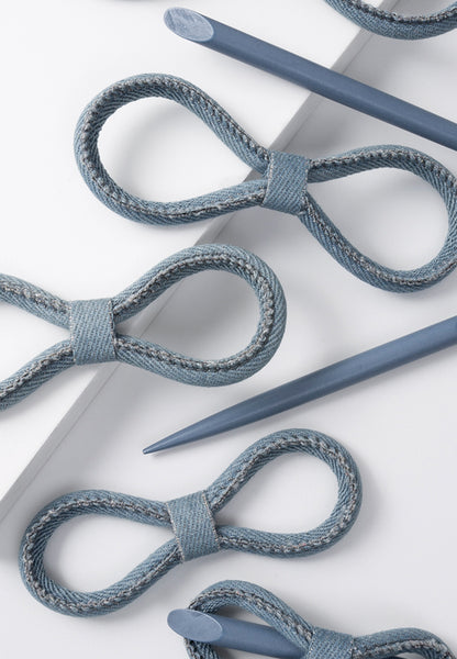 Chambray stitched on one side for a textured look and reversible for a smooth choice. Sold with coordinating stick.