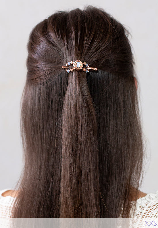 Opaline Flexi with a delicately framed opal stoneset shown in hair. Shown in rose goldtone.