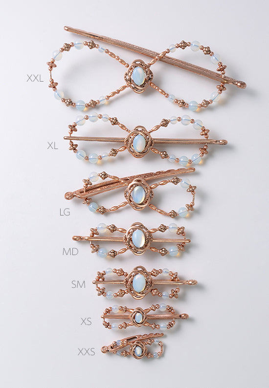 Opaline Flexi Clip in rose goldtone with a delicately framed opal stoneset. Shown in all 7 sizes.