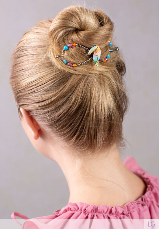 Flexi hair clip with toucan and fun, bright colors and beads.