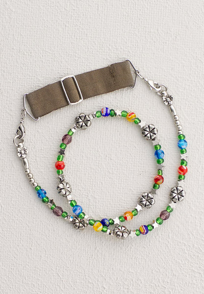 Beaded hairband with a variety of silver and bright colors.
