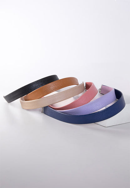 Durable and flexible faux leather hairbands in a variety of colors.