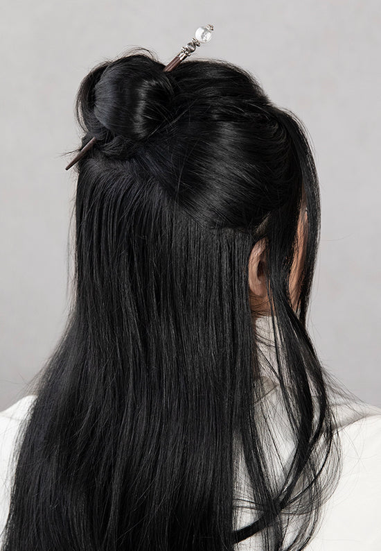 White Tabitha hair stick shown in hair with marbled white howlite stone.
