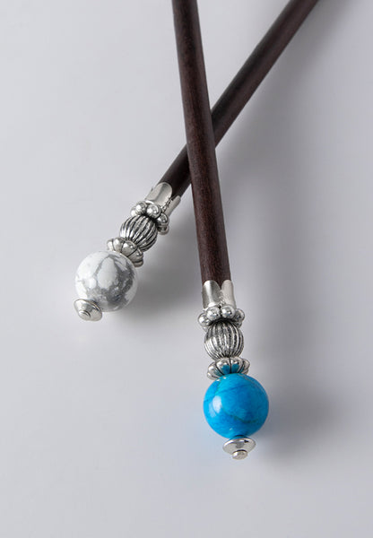 Tabitha hair sticks with marbled turquoise and white howlite stones.