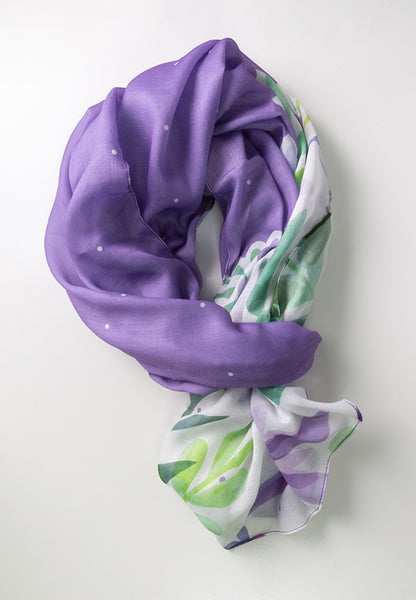 Purple scarf with white dots, adorned with purple flowers and green leaves.