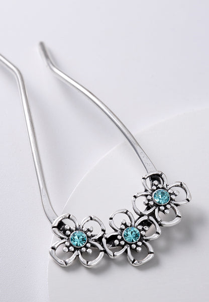 Decorative turquoise stone set swerve hair pins.