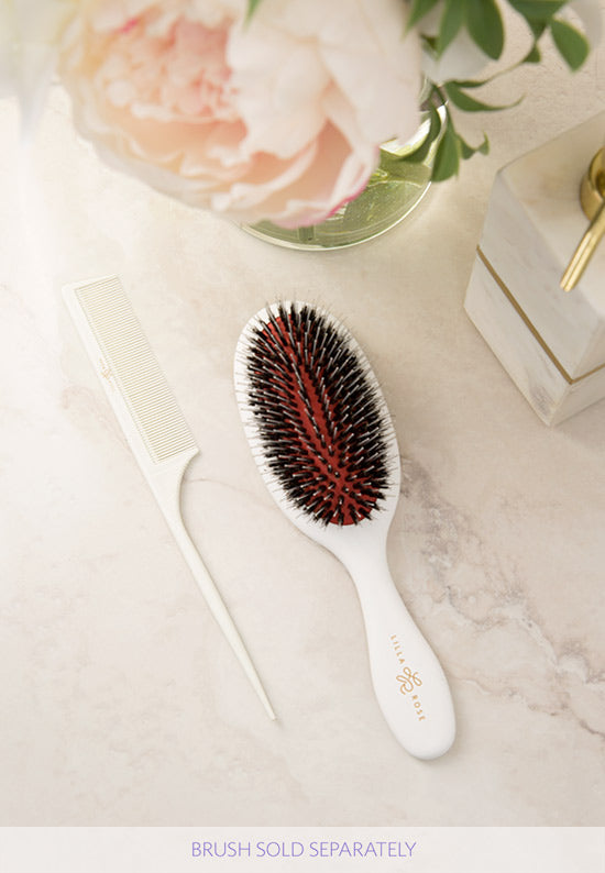 White comb and brush with the Lilla Rose logo.